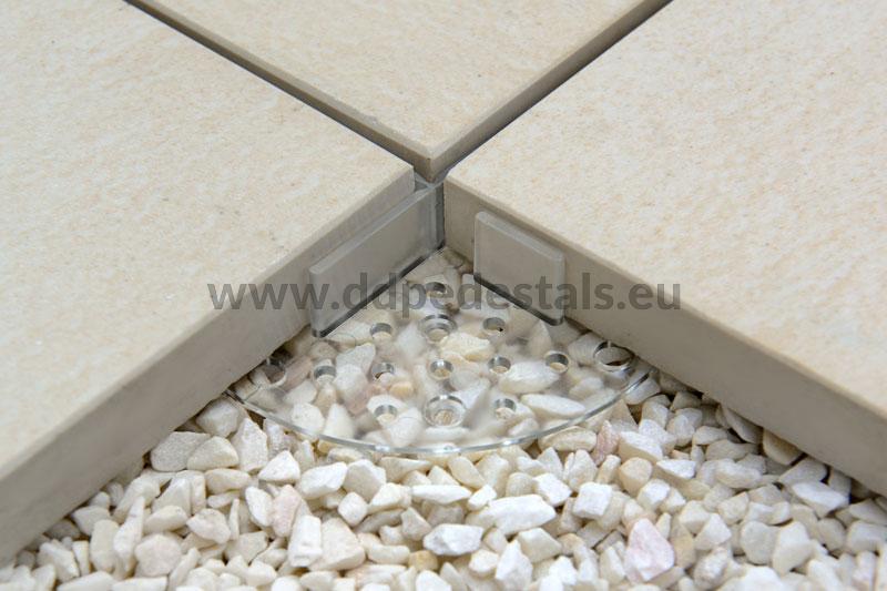 Transparent support pad under terrace tiles for dry installation, e.g. on gravel