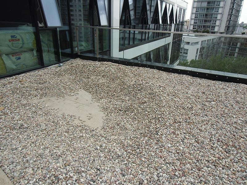 gravel on the roof of the office building, the ground for the ventilated terrace