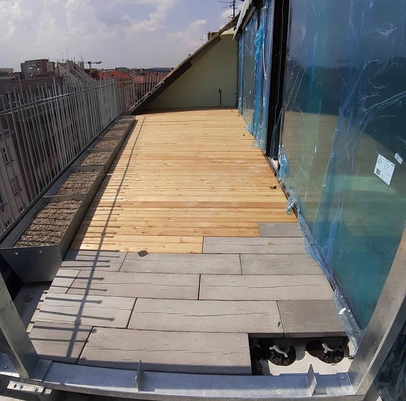 terrace made of two different materials - wooden boards and tiles , panels