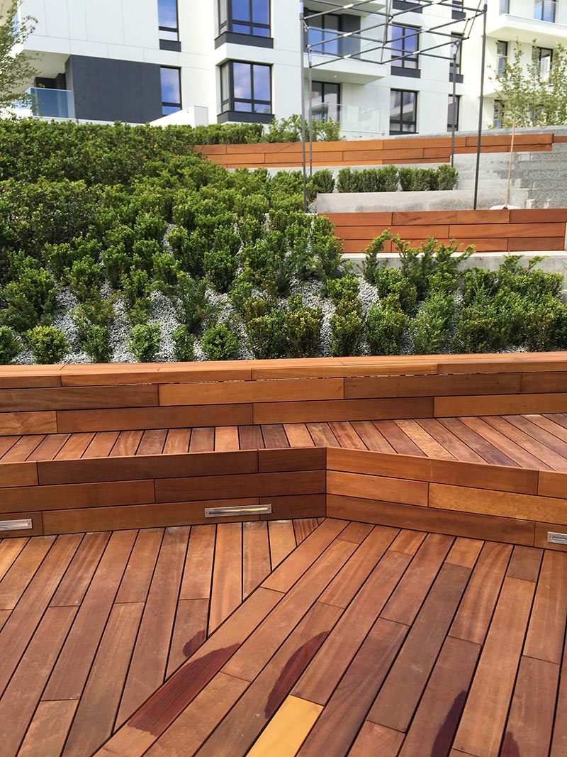 ventilated wooden terraces on the patio between the blocks of flats